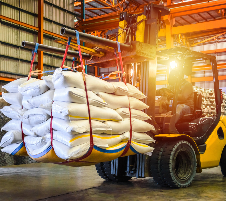 Forklift carrying bags.